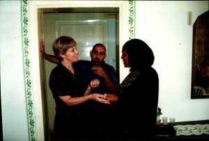 Fotma receiving a ribbon for completing the lessons