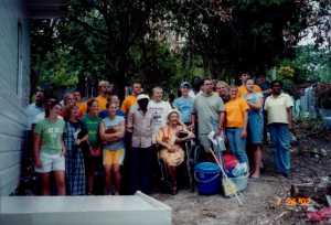 Presenting the keys of the finished house to the new owners. Note cleaning supplies.