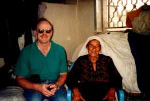 Ministry partner Steve Walker and Kodra inside her house.