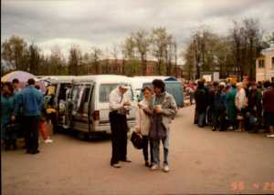 Passing out bibles. The people are happy to get one.