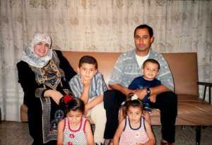 Woofaa, Hassan, Kahjlil holding Mohammed. Ressan, Jeanan