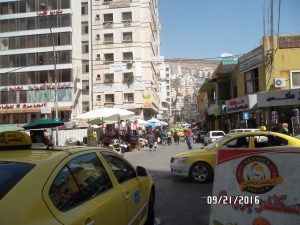 Notice the people in the street